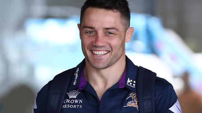 Cooper Cronk smiles on arrival in Sydney for the grand final.