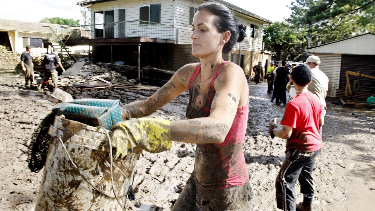 Gold Coast resident Aleaysha Burney helping with the flood clean up at Brisbane Tce, Goodna. Photo: Sarah Harvey/ The Queensland Times