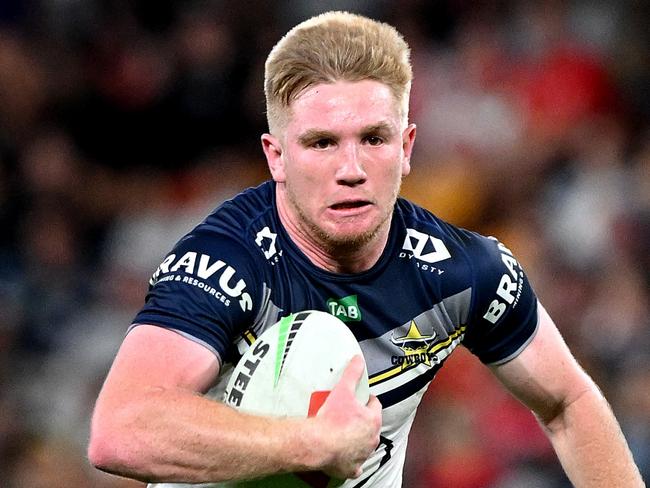 BRISBANE, AUSTRALIA - AUGUST 25: Tom Dearden of the Cowboys breaks away from the defence during the round 26 NRL match between Dolphins and North Queensland Cowboys at Suncorp Stadium on August 25, 2023 in Brisbane, Australia. (Photo by Bradley Kanaris/Getty Images)