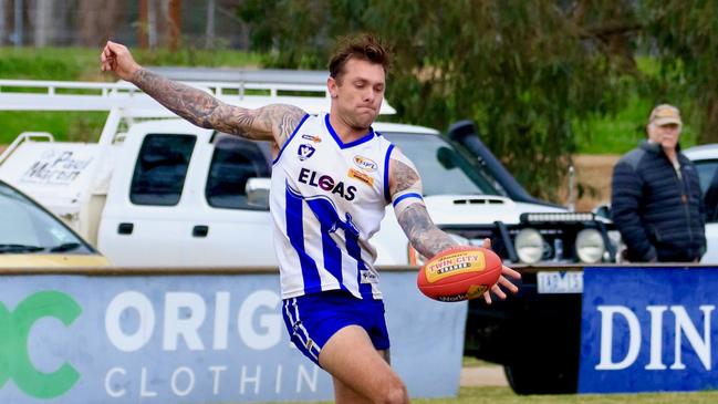 Trent Castles snaps one of his 109 goals for Yackandandah this year.