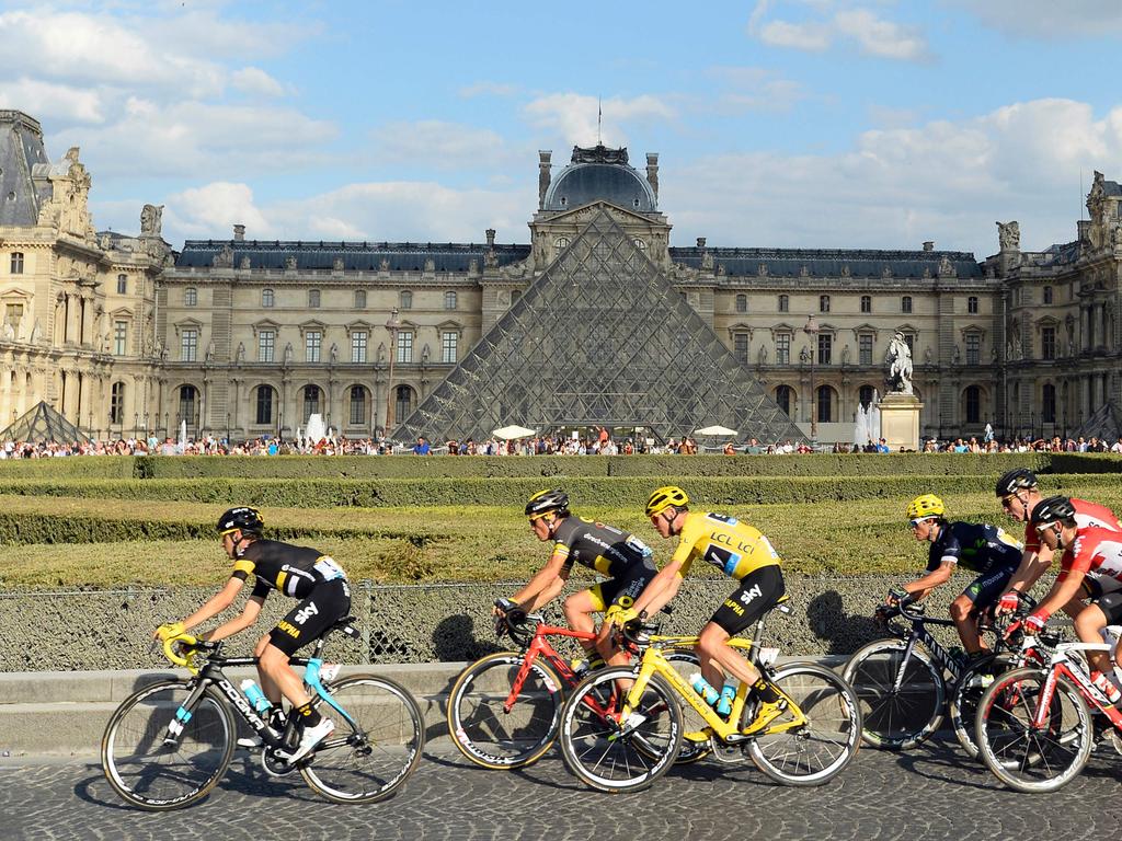 The pack rides past the Pyramide du Louvre (Louvre Pyramid) during the 113km twenty-first and last stage of the 103rd edition of the Tour de France cycling race on July 24, 2016 between Chantilly and Paris Champs Elysees. Picture: AFP PHOTO / BERTRAND GUAY