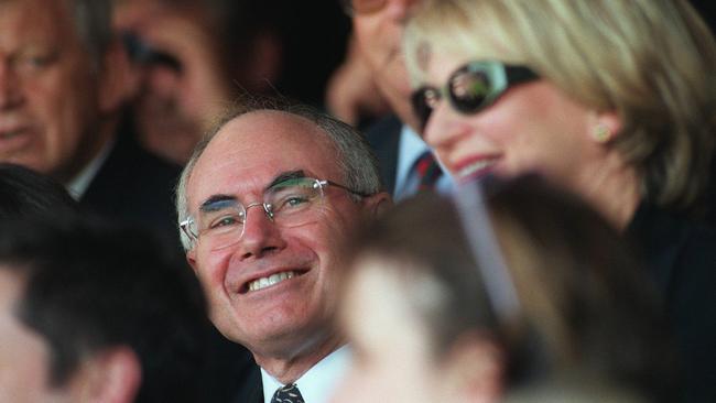 Former PM John Howard at the MCG watching a Crows versus Roos grand final.