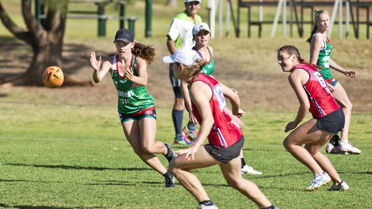 CLOSE FINAL: Sharks player Izzy Reed lines up the ball during her side's Toowoomba Touch Association grand final clash against Roosters. Roosters won the match 4-1. Picture: Nev Madsen