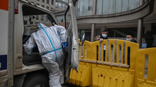 Outside the Jade Boutique Hotel in Wuhan, where members of the WHO team were about to clear quarantine on Thursday. Picture: AFP