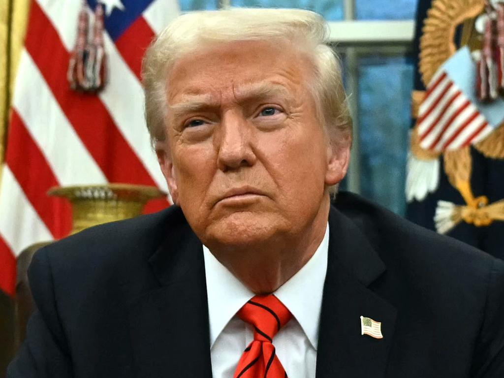 TOPSHOT - US President Donald Trump speaks to the press after signing an executive order in the Oval Office of the White House in Washington, DC, on February 10, 2025. (Photo by ANDREW CABALLERO-REYNOLDS / AFP)