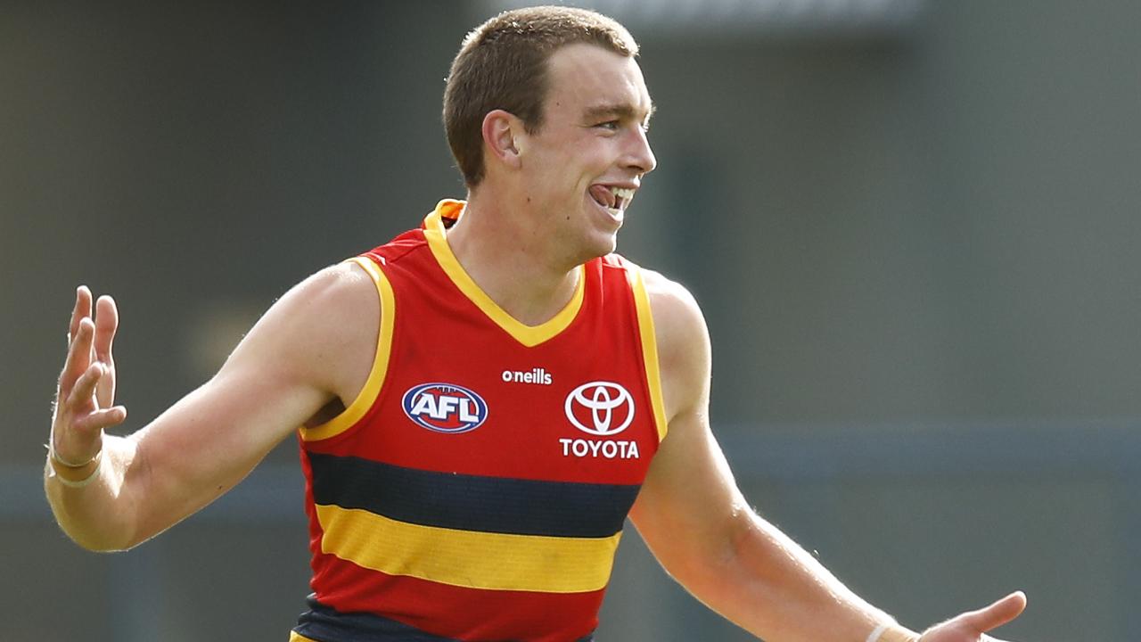 Riley Thilthorpe celebrates one of his goals on debut for Adelaide.