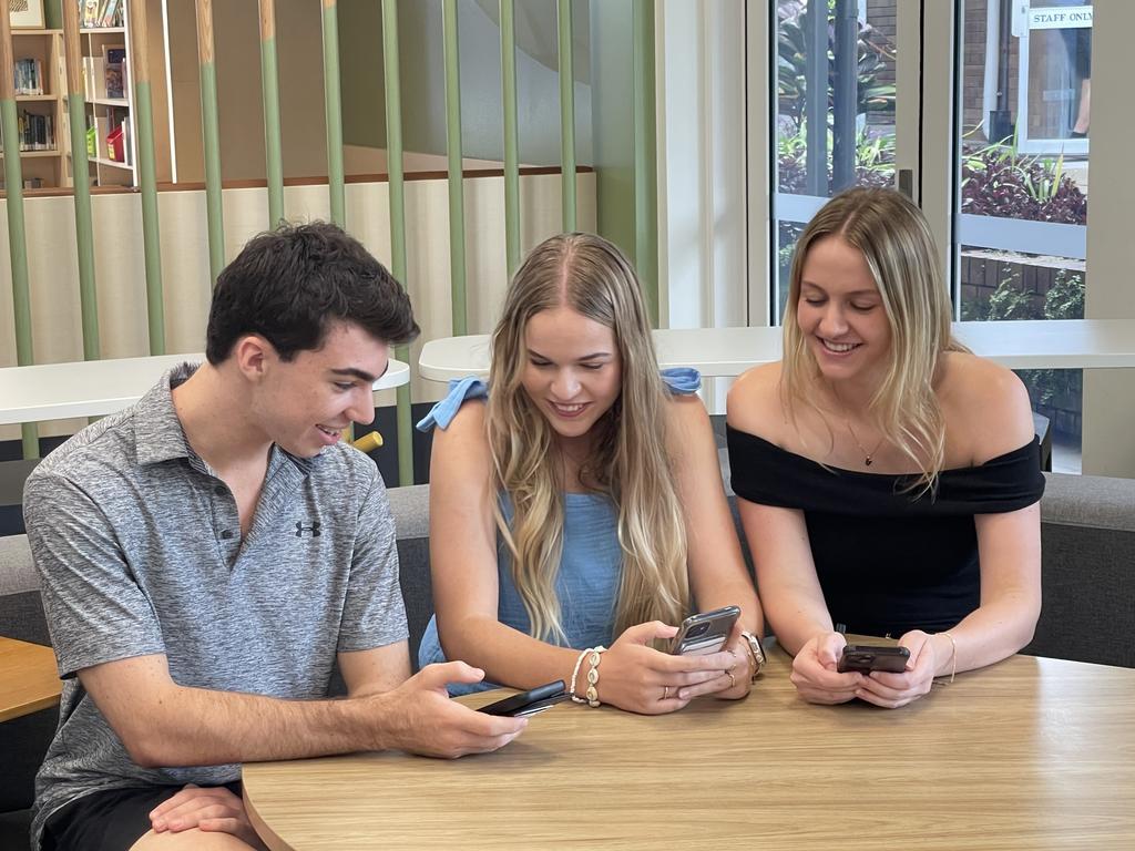 Whitsunday Anglican School year 12s Dylan Itzstein, Hayley Wilkins and Eden Bagley were beaming as their near perfect scores came in. Photo: Fergus Gregg