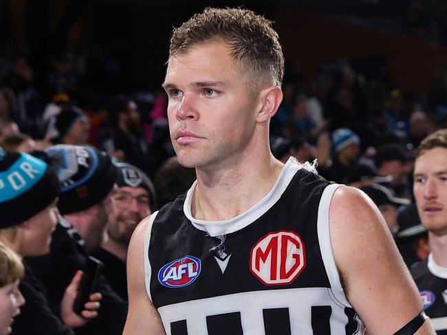 ADELAIDE, AUSTRALIA - AUG 17: Dan Houston of the Power with fans after the win during the 2024 AFL Round 23 match between the port Adelaide Power and the Adelaide Crows at Adelaide Oval on August 17, 2024 in Adelaide, Australia. (Photo by Sarah Reed/AFL Photos via Getty Images)