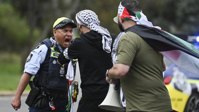 Protesters on their way to the South African embassy in Canberra clash with AFP officers. Picture: NCA NewsWire / Martin Ollman