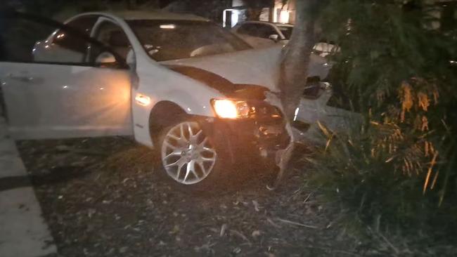 A white Holden Commodore pictured after it crashed on a Coomera street last night. Picture: Coomera Community Page / Facebook.