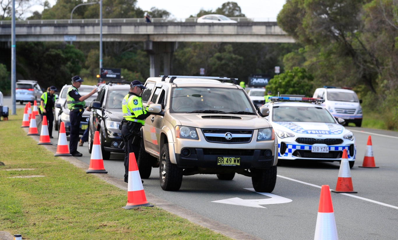 Queensland Police set up a road block due to the Corona Virus at the NSW / Queensland Border on the old Pacific Highway at Coolangatta. Photo: Scott Powick Newscorp