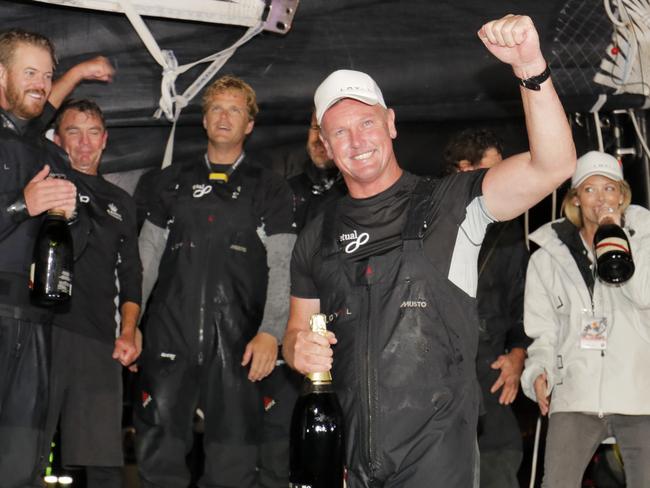 Skipper/Owner Anthony Bell celebrates his the with the crew. Picture: Richard Jupe