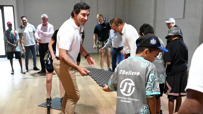 Johnathan Thurston and the Queensland Premier Steven Miles race each other in teams with JTYouGotThis program graduates, in a game that involves building bridges across ‘lava’. Picture: Shae Beplate.