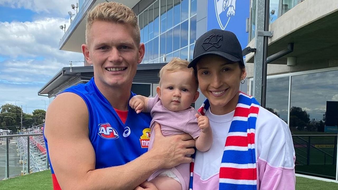 New Western Bulldogs player Adam Treloar and wife Kim Ravallion with daughter Georgie.