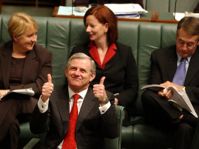 <p>Ms Gillard takes a seat behind former Labor leader Simon Crean after he beat Kim Beazley to head the Labor party in 2003. Picture: John Feder</p>