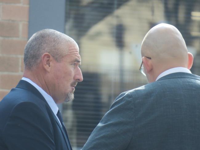 Meston (left) outside Wyong Local Court with his lawyer at a previous appearance. Picture: NewsLocal