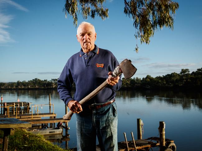 Neil Kerley with his trusty axe — he was still cutting his own firewood, aged 88. Picture: Matt Turner