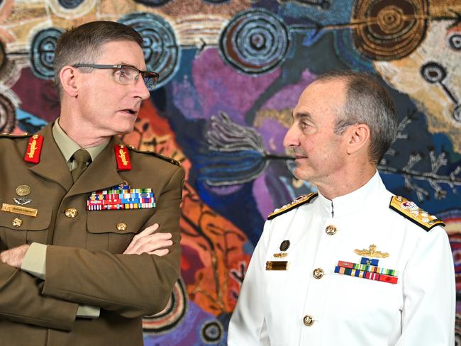 Current Chief of the Australian Defence Force General Angus Campbell (left) and incoming Chief of the Australian Defence Force Vice Admiral David Johnston pose for photographs at the Russell buildings in Canberra, Tuesday, April 9, 2024. (AAP Image/Lukas Coch) NO ARCHIVING