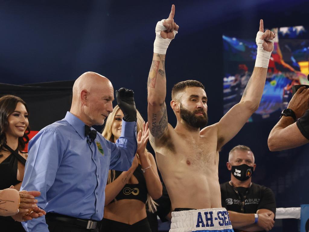 Sam Ah See raises his arms in the air after winning his welterweight fight against Czar Amonsot. (Photo by Mark Evans/Getty Images)