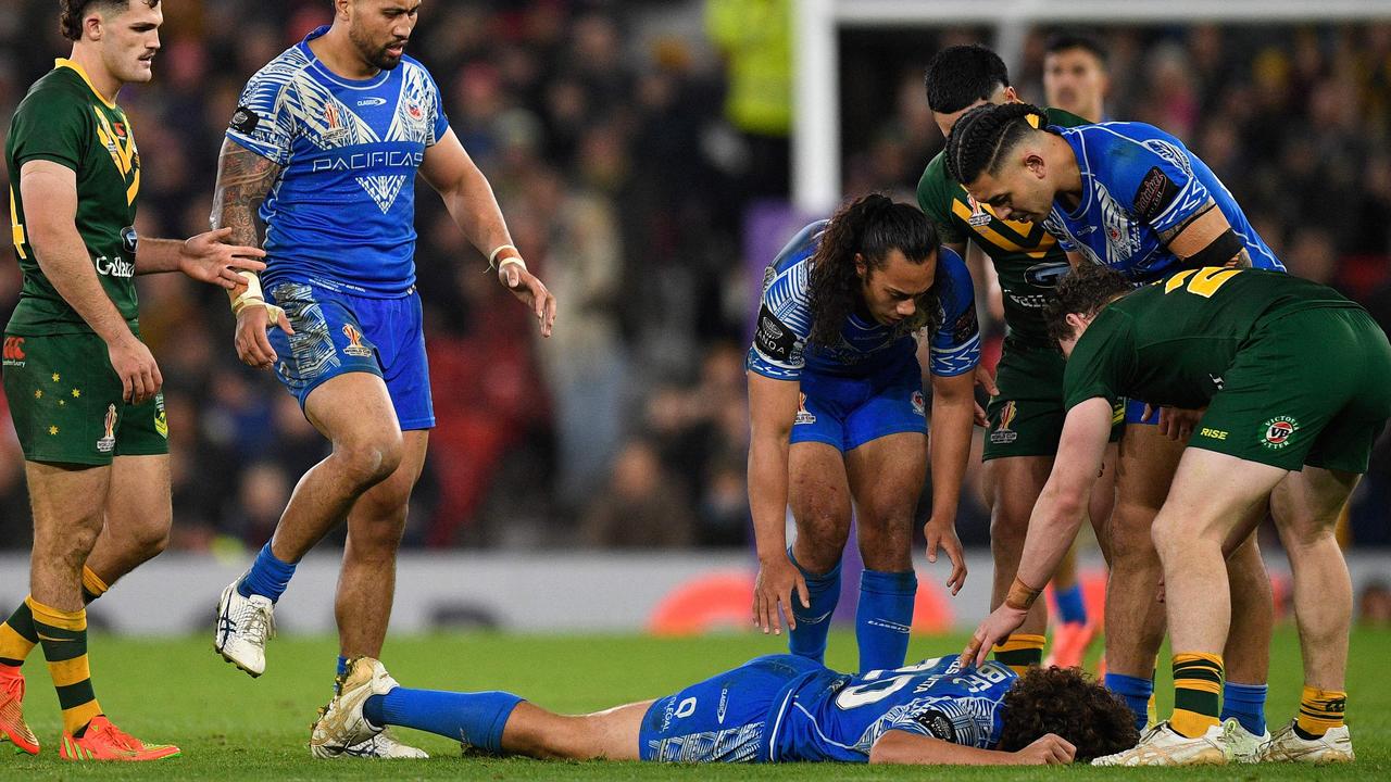 Players check on Samoa’s Chanel Harris-Tavita after the hit. Picture: AFP Images