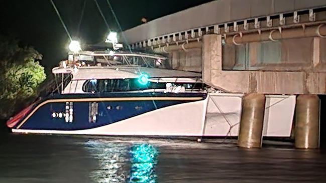 A boat stuck under a bridge in the Camden Haven area near Port Macquarie.