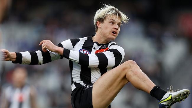 MELBOURNE, AUSTRALIA - JUNE 26: Jack Ginnivan of the Magpies kicks the ball during the 2022 AFL Round 15 match between the Collingwood Magpies and the GWS Giants at the Melbourne Cricket Ground on June 26, 2022 in Melbourne Australia. (Photo by Michael Willson/AFL Photos via Getty Images)