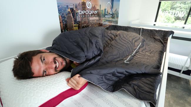 Matt Gillett with his custom fit pillow and mattress at the Broncos’ sleep centre. Photo: Liam Kidston.