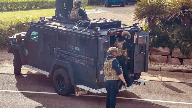 Heavily-armed police officers swarmed on a Cullen Bay Crescent home where they arrested a 53-year-old man over alleged serious harm offences. Picture: Supplied