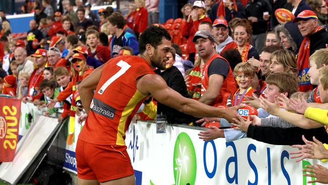 Fans show their appreciation to Karmichael Hunt playing with the Gold Coast Suns.