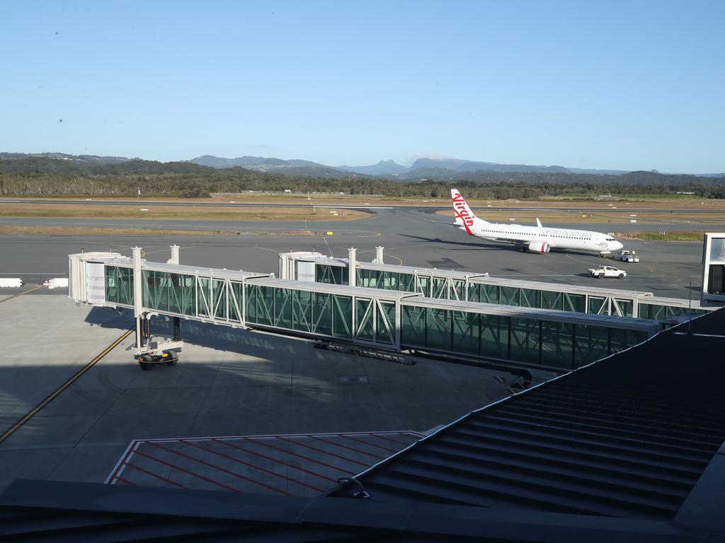 Aerobridges stretch out from the new terminal. Picture: Glenn Hampson.