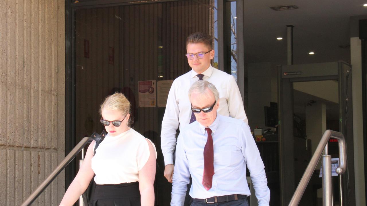 Lawyer David Robinson (right), representing the Department of Infrastructure, Lands, and Planning, leaves the Alice Springs Local Court. Picture: Gera Kazakov