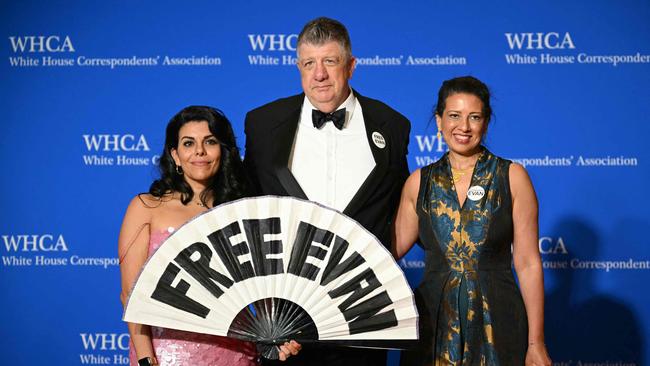 Members of The Wall Street Journal hold a sign reading ‘Free Evan’ as they arrive for the White House Correspondents' Association dinner in Washington. Picture: AFP