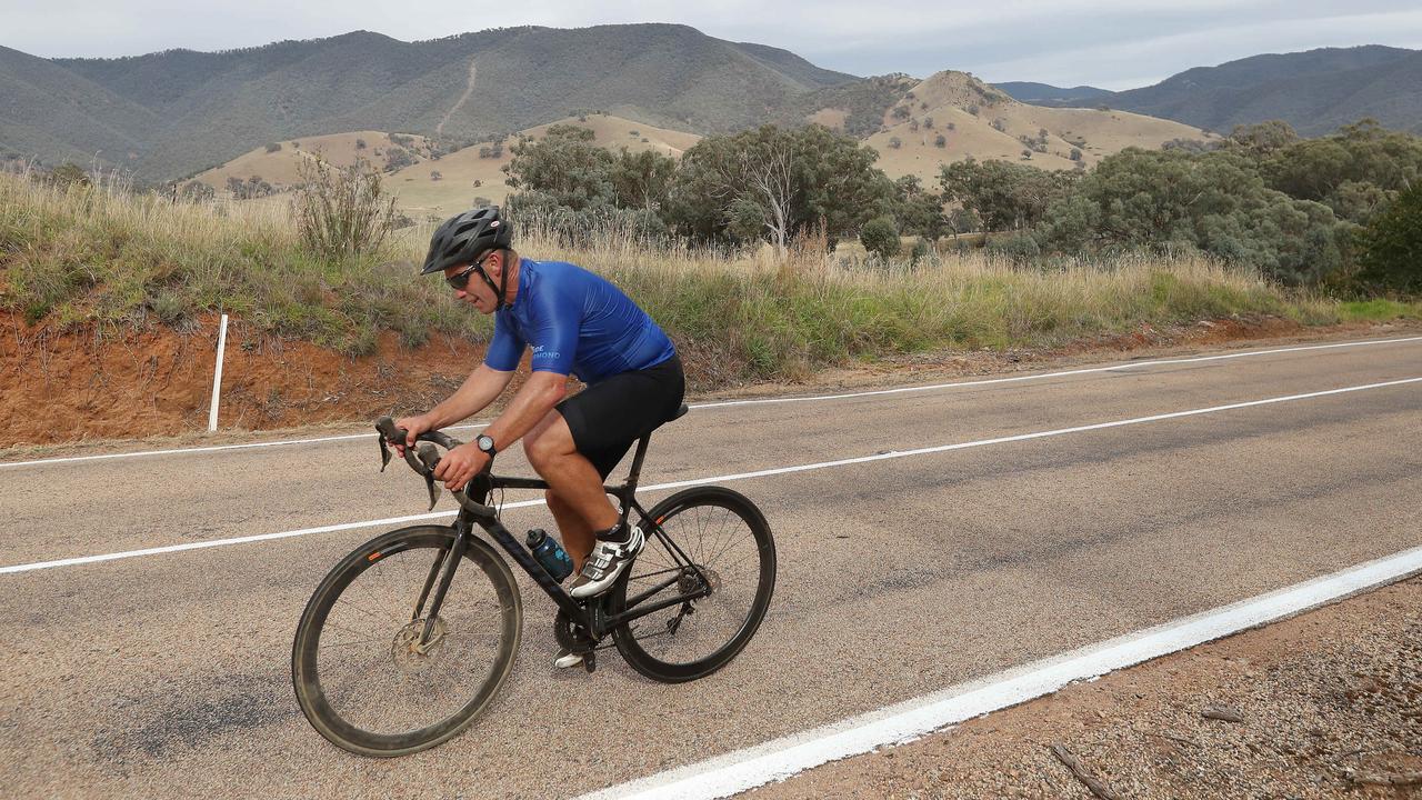 Hawthorn coach Alastair Clarkson rides from Omeo to Buchan in support of bushfire relief awareness after last year’s devastating fires in the area. Picture: Michael Klein