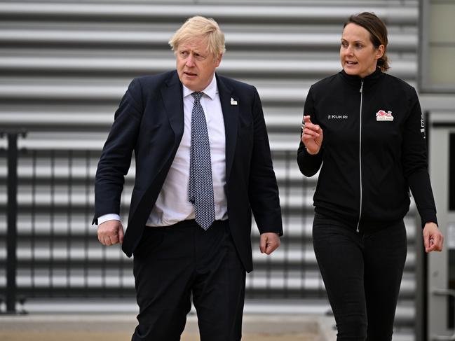 BIRMINGHAM, ENGLAND - MAY 12: UK Prime Minister Boris Johnson (L) speaks with Team England track and field team leader Kelly Sotherton (R) during a visit to the Alexander Stadium on May 12, 2022 in Birmingham, England.  (Photo by Oli Scarff - WPA Pool/Getty Images)