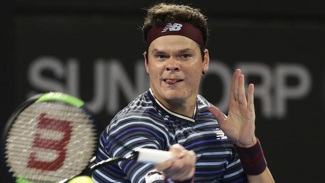 Milos Raonic hits a return to Alex De Minaur on Wednesday night.