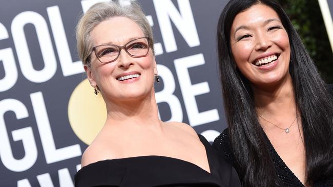 Meryl Streep and Ai-jen Poo, the head of the National Domestic Workers Alliance, arrive for the Golden Globes. Picture: AFP.