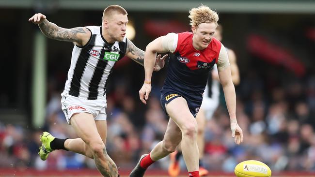 Jordan De Goey pursues Clayton Oliver during the Queen’s Birthday clash on Monday. Picture: Matt King/Getty Images