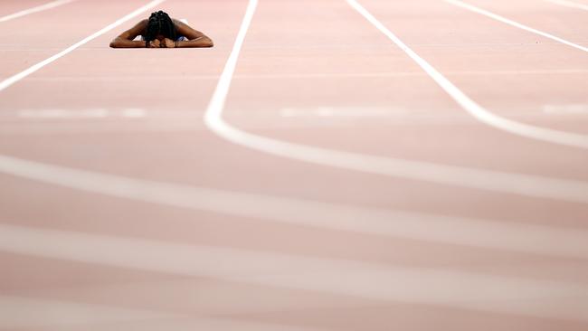 English Gardner of the United States reacts to an injury during the Women's 100 Metres semi-final.