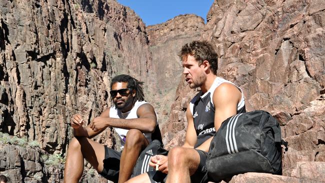 Heritier Lumumba and Luke Ball take a break on a hike in the Grand Canyon. Picture: collingwoodfc.com.au