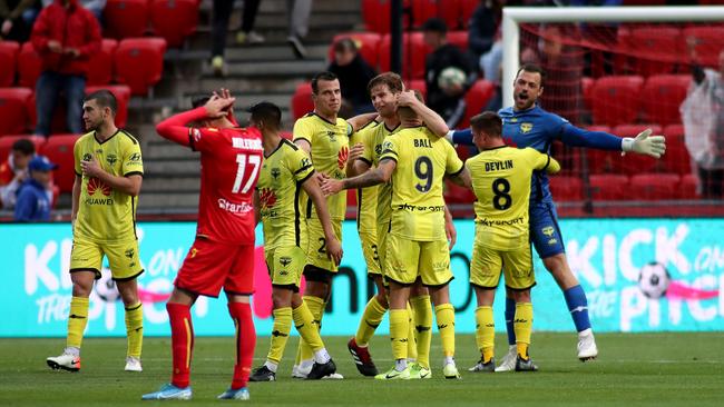 Phoenix players celebrate the win. Picture: AAP/Kelly Barnes