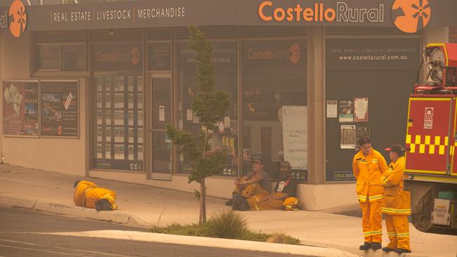 Exhausted firefighters in Corryang. Picture: Jason Edwards