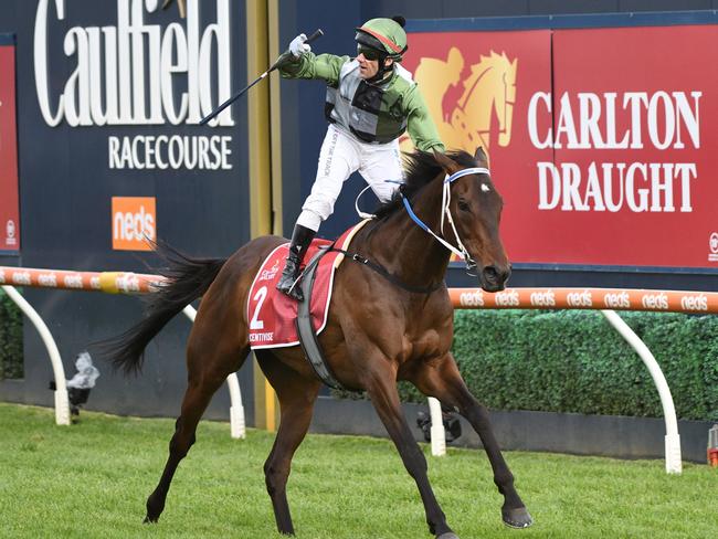 Brett Prebble riding Incentivise to victory in the Caulfield Cup. Picture: Getty