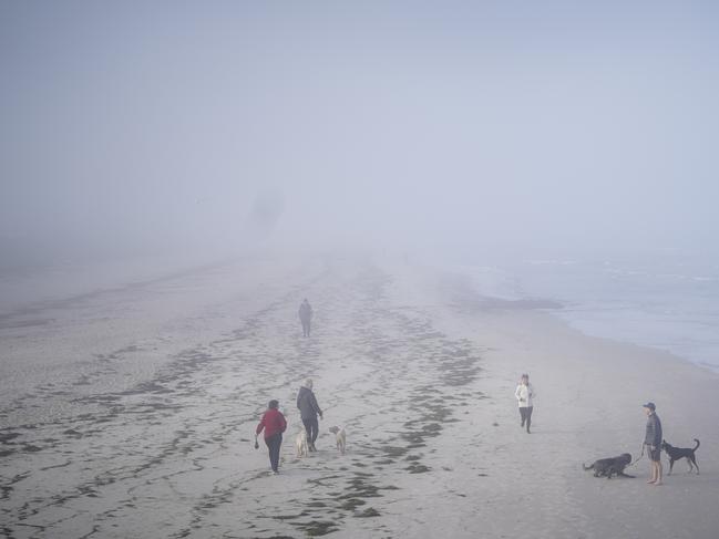 People out on a foggy and cold morning at Grange Beach, Sunday August 16, 2020 - pic MIKE BURTON