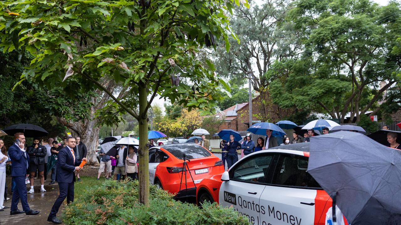Umbrellas aplenty at the sale of 33 Renwick St, Alexandria