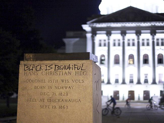 The base of a statue of Colonel Hans Christian Heg, a Union Civil War colonel who fought for the end of slavery, remains after it was torn down by protesters. Picture: AP