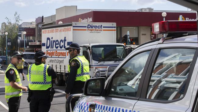 Police at the scene after a pedestrian was struck by a truck on the intersection of Wilson and Cattley streets in Burnie. Picture: CHRIS KIDD