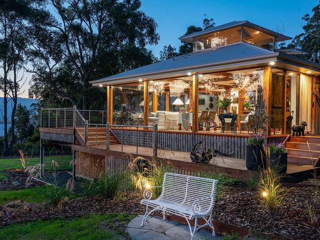 Huon River Hideaway file 4 exterior of Huon River Hideaway showing side wall of full length windows. MUST CREDIT Jon Jarvela photographs For a TasWeekend travel story.