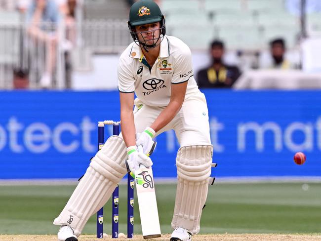 TOPSHOT - Australian batsman Sam Konstas plays a ramp shot on the first day of the fourth cricket Test match between Australia and India at the Melbourne Cricket Ground (MCG) in Melbourne on December 26, 2024. (Photo by William WEST / AFP) / -- IMAGE RESTRICTED TO EDITORIAL USE - STRICTLY NO COMMERCIAL USE --