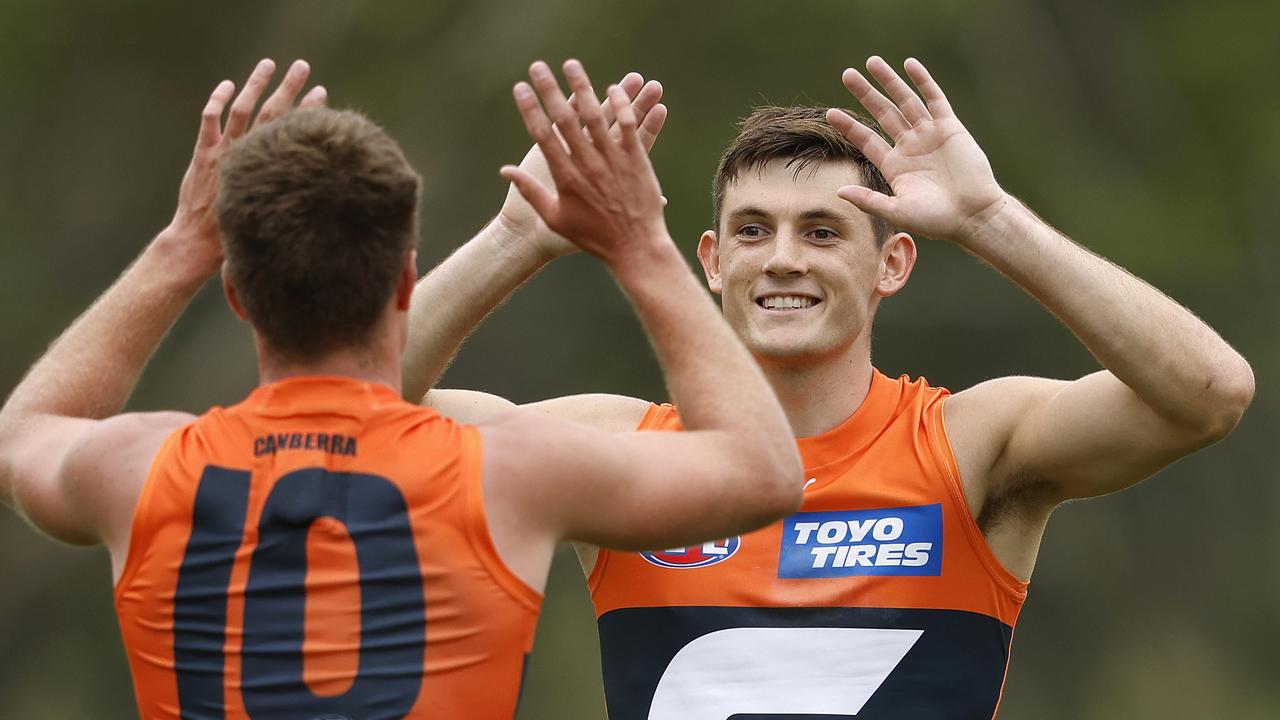 Giants Conor Stone celebrates kicking a goal with Jacob Wehr during an AFL pre-season practice match between the GWS Giants and Gold Coast Suns at Blacktown International Sportspark on March 4, 2023. Photo by Phil Hillyard (Image Supplied for Editorial Use only - **NO ON SALES** - Â©Phil Hillyard )