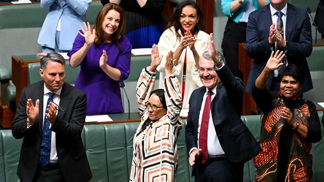 Linda Burney and Mark Dreyfus react after the introduction of the bill to establish an Aboriginal and Torres Strait Islander voice in the House of Representatives.